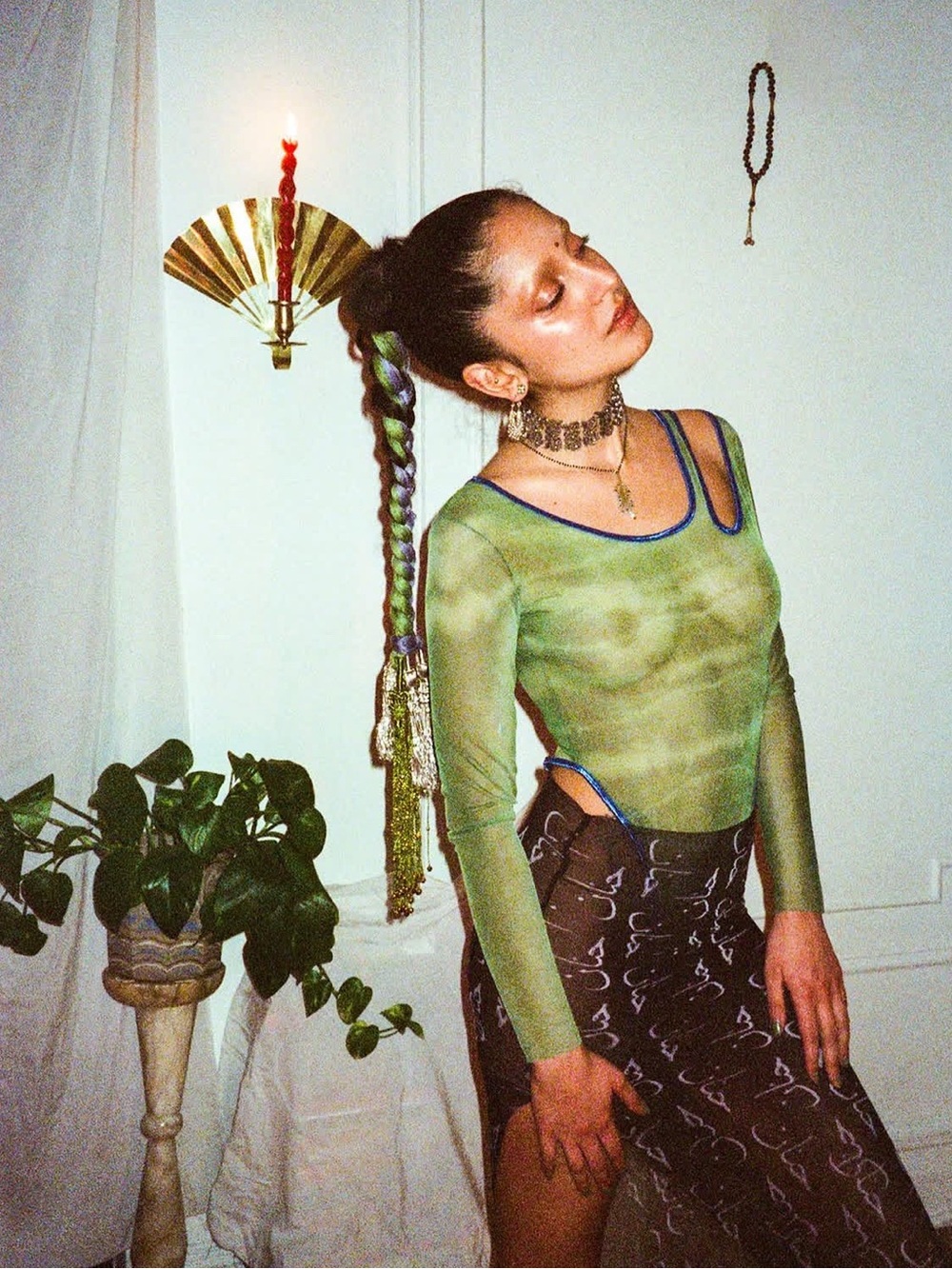 Sheer green thong bodysuit by designer Hanan Sharifa
